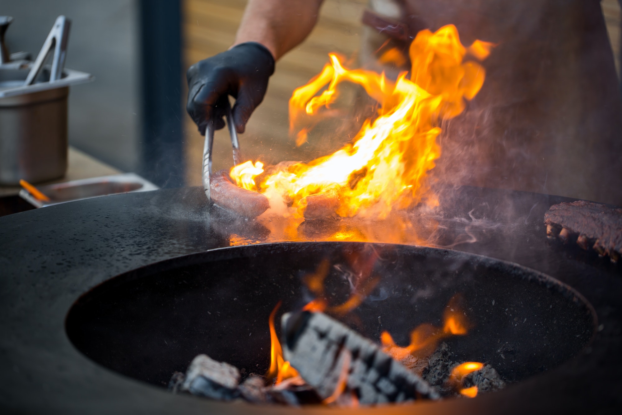 Sausage on Barbeque Smoker Grill. Hot and smoked sausage. Food Festival